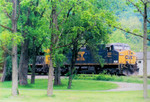 Railfanning delight! I snapped this picture in front of Joe's Place as helper takes a coal drag across CSX bridge heading east toward Cumberland.